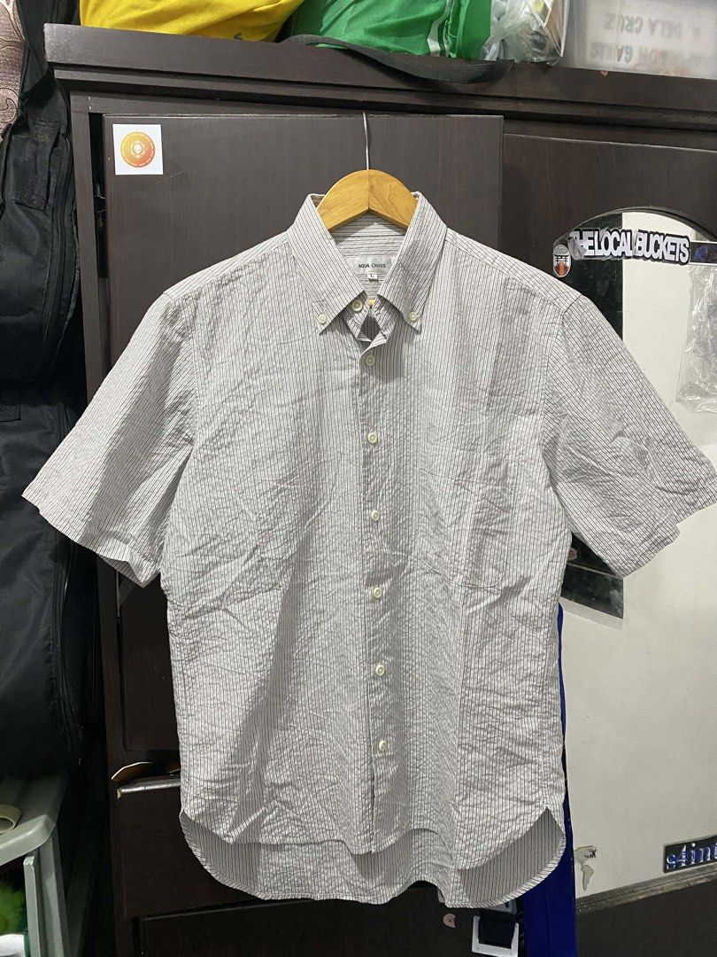 Aqua Cross Short Sleeve Button Up Shirt (Category: Tshirts & Polo Shirts ) located in Cavite. Submitted by grabanddeclutter (Listing ID 1448829082, Image 1). Description: -Subtle stripe pattern - Button-down collar - Versatile for casual or slightly dressed-up occasions - Effortless to style - ISSUE: stain see last 2pics - DIMENSIONS: W20.5 Length front 25.5 Back 28 No COD gcash payment Plus shipping fee Jnt or lalamove.
