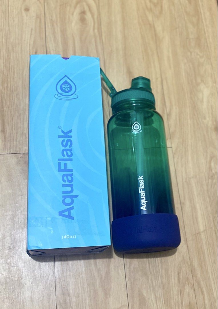 AquaFlask Trek Tritan Bottle 40oz - Conner (Authentic) (Category: Water Bottles & Tumblers) located in Calamba. Submitted by eleazthriftshop (Listing ID 1448805076, Image 2). Description: - AquaFlask Water Bottle - 40oz capacity - Includes straw lid - Comes with protective silicone boot - Stylish green to blue gradient design - Original box included - Ideal for staying hydrated on the go.