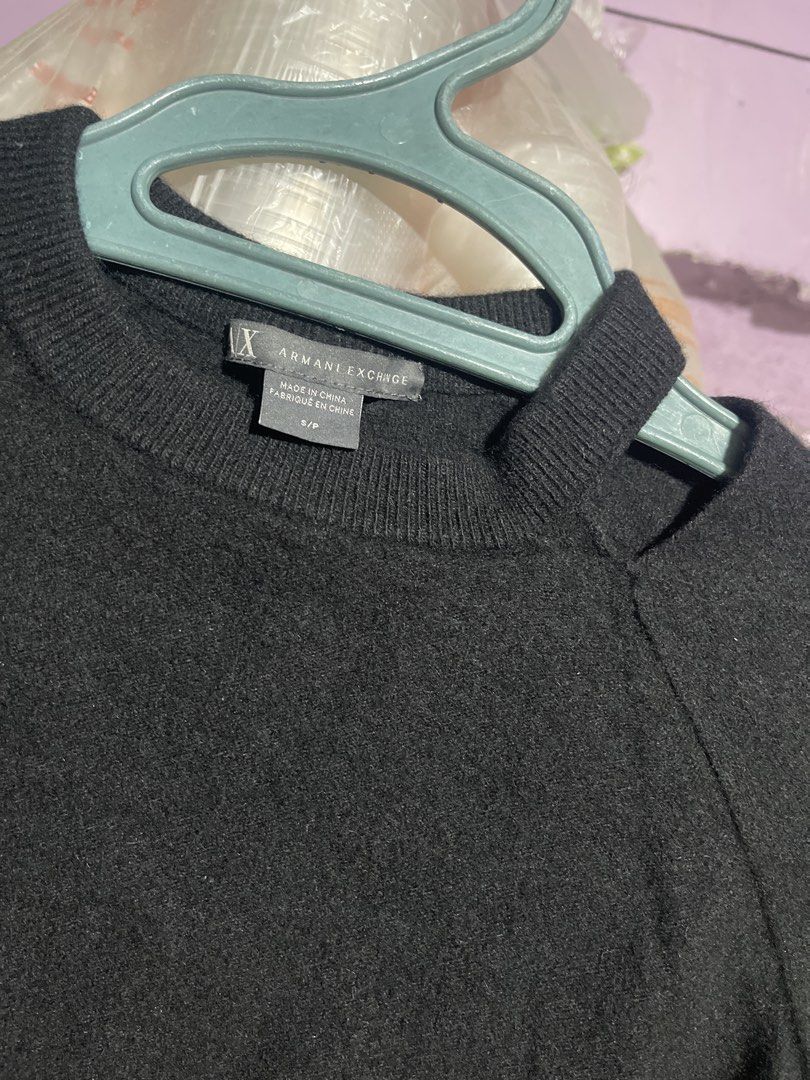 Armani Exchange Black Cut-Out Shoulder Sweater (Category: Coats, Jackets and Outerwear) located in Valenzuela. Submitted by wonderland_19 (Listing ID 1448698817, Image 2). Description: - Armani Exchange black sweater - Size S/P - Unique shoulder cut-out detail - Versatile for layering or wearing solo - Simple and chic design.