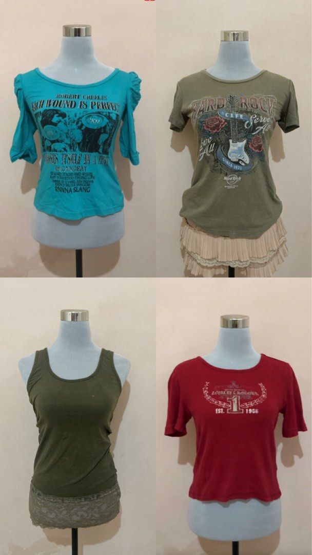 Assorted Graphic Tees and Tank Top Bundle Pattern y2k style grunge (Category: Blouses) located in Hamtic. Submitted by crispicks (Listing ID 1448737637, Image 1). Description: Bundle of four tops. Includes a blue graphic tee with puff sleeves, a green Hard Rock Cafe tee, a green tank top with lace trim, and a red graphic tee. Great for casual wear. Some flaws.