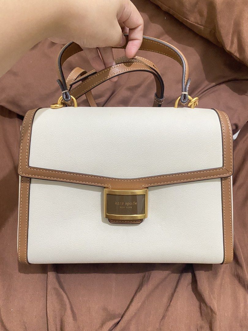 Authentic Kate Spade Medium Katy Top Handle Bag in Textured Leather (Category: Luxury Bags & Wallets) located in Manila. Submitted by hernarchangela (Listing ID 1448754894, Image 1). Description: - Bought for ₱23,000+ in 2023 - Original dust bag included - Excellent condition - Well-maintained and stored properly - RFS: Need extra funds and I don’t really use it anymore, it’s just been sitting in my closet..