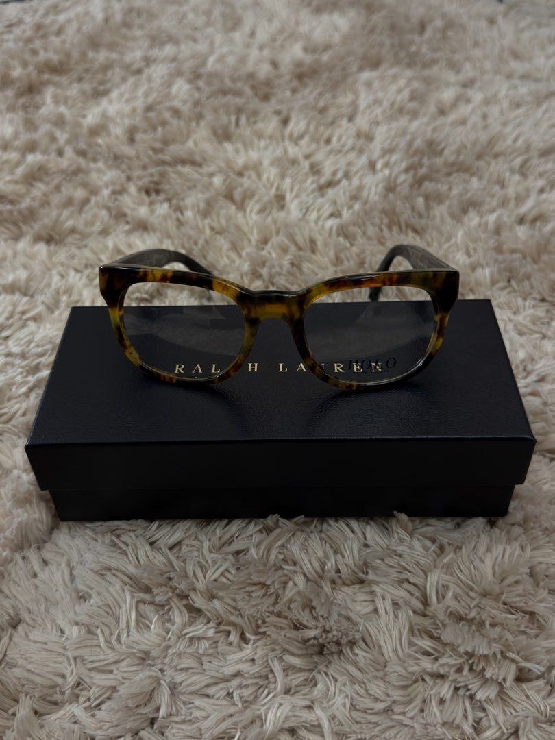 Authentic Ralph Lauren Tortoiseshell Eyeglasses with Case and Box (Category: Sunglasses & Eyewear) located in Manila. Submitted by urbanglasses.mnl (Listing ID 1448741928, Image 1). Description: - Authentic Ralph Lauren eyeglasses - Stylish tortoiseshell pattern on frames - Comes with original hard case - Includes original cleaning cloth - Presented in its original box - Ideal for everyday wear or as a fashion accessory.