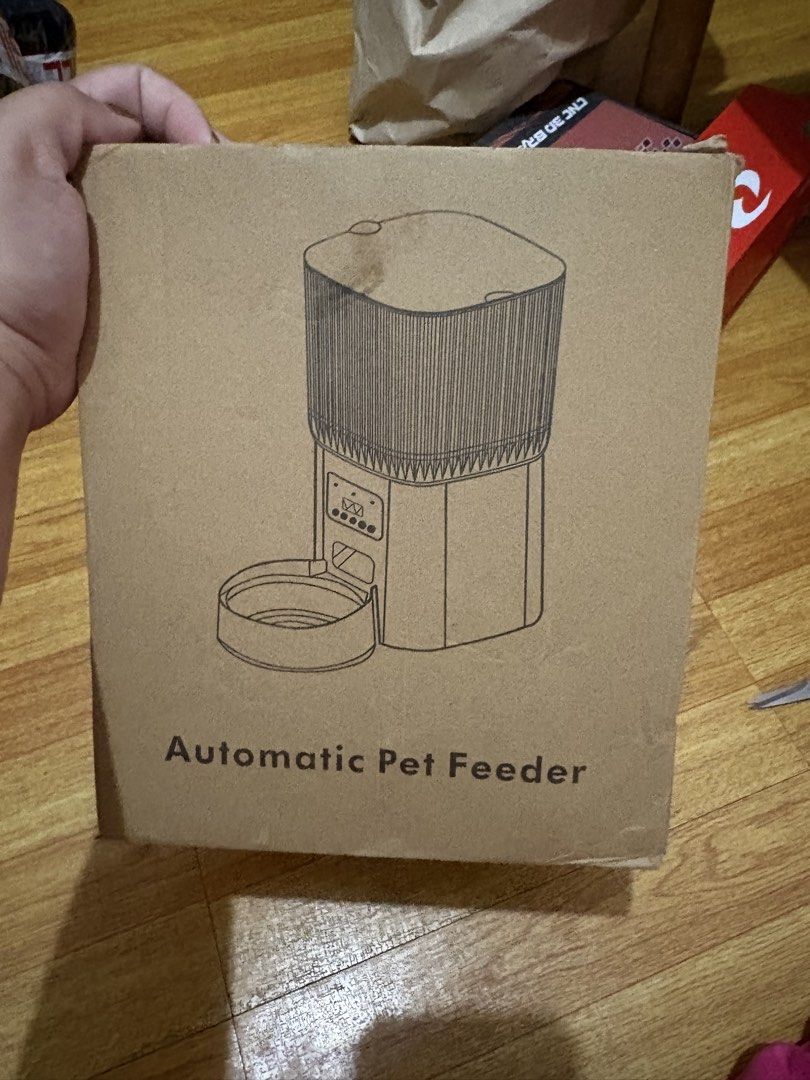 Automatic Pet Feeder 5L WiFi+Video MODEL (Category: Homes & Other Pet Accessories) located in Bacoor. Submitted by cathshoppit (Listing ID 1448890960, Image 1). Description: Automatic pet feeder with 5L capacity. Connects via WiFi and has HD video. You can feed your pet remotely. Great for when you're away for work or short trips. Has backup battery option for power outages. Easy to use and set up. NEVER BEEN USED.