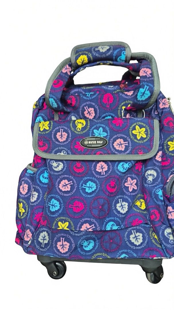 Backpack with rollers (Category: Backpacks) located in Singapore. Submitted by copycatz (Listing ID 1448730266, Image 1). Description: - Fun tree and leaf pattern on a navy blue base. - Colorful accents add a pop of style. - Features a top handle and wheels for effortless transport. - Perfect for school or travel adventures. - Ample interior space for all your essentials..
