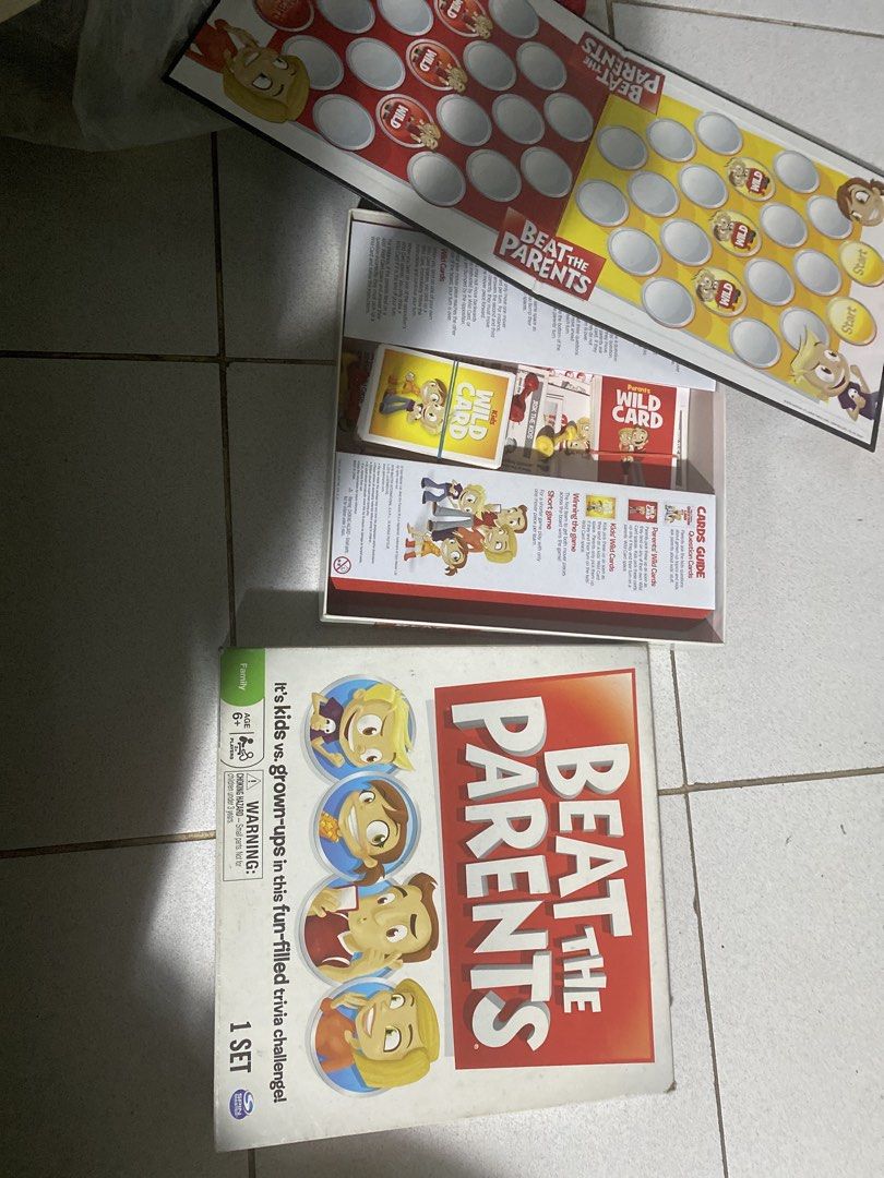 Beat the Parents Trivia Board Game (Category: Board Games & Puzzles) located in Pasig City. Submitted by ayi017 (Listing ID 1448758331, Image 1). Description: - Beat the Parents trivia board game - Fun challenge: Kids vs. Grown-ups! - Includes wild cards and game cards - Perfect for family game nights - Suitable for ages 6 and up - One set included Complete.