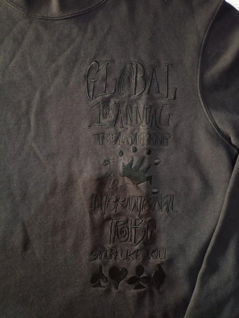 Black Crewneck Sweatshirt with Graphic Print (Category: Longsleeves) located in Caloocan City. Submitted by grandturtle-371b8d (Listing ID 1448765010, Image 2). Description: - Black crewneck sweatshirt - Raised graphic print on front - Text: 'GLOBAL 14TH ANNIV', 'INTERNATIONAL', 'SYRUP LIKE YOU' - Spade, club, heart, and diamond symbols at bottom - Long sleeves - Ribbed cuffs and hem.