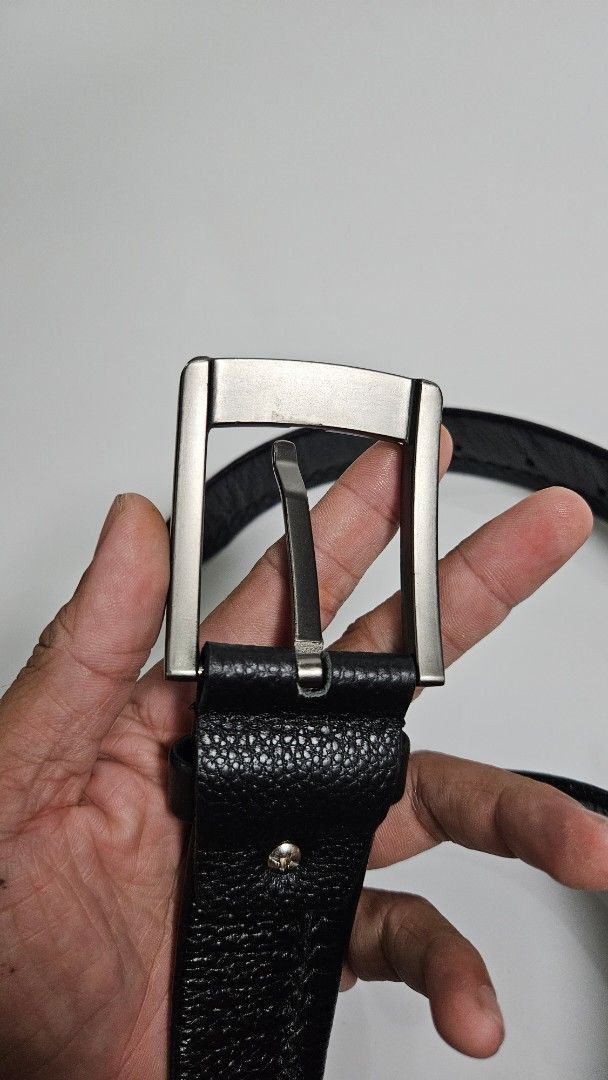 Black Leather Belt with Silver Buckle (Category: Belts) located in Alfonso. Submitted by jbcamet (Listing ID 1448834295, Image 2). Description: - Classic black leather belt - Textured leather finish - Modern silver-tone buckle - Simple and versatile design - Perfect for everyday wear - Fits most waist sizes.