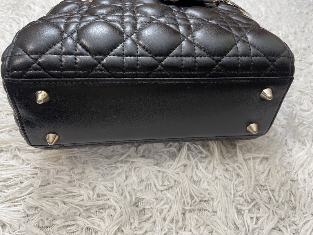 Black Quilted Handbag (Category: Luxury Bags & Wallets) located in Quezon City. Submitted by impulse.ph (Listing ID 1448755340, Image 2). Description: - Classic black quilted handbag - Features a top handle - Secure zipper closure - Elegant gold hardware details - Compact and stylish size - under zip shows Christian Dior.