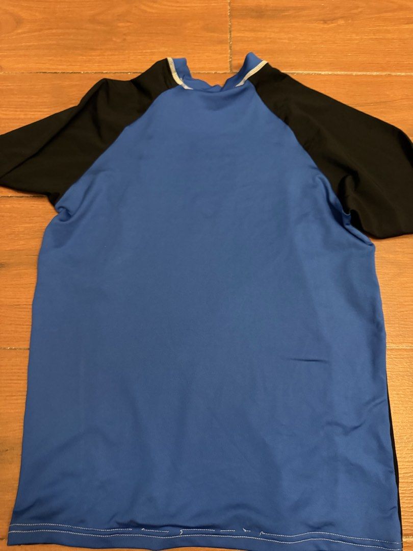 Blue and Black Long Sleeve Rash Guard (Category: Babies & Kids Fashion) located in Bulacan. Submitted by emjay_17 (Listing ID 1448782993, Image 2). Description: - Long sleeve rash guard - Blue front and back panels - Black sleeves - White contrast stitching - Ideal for swimming or sun protection - Comfortable fit.