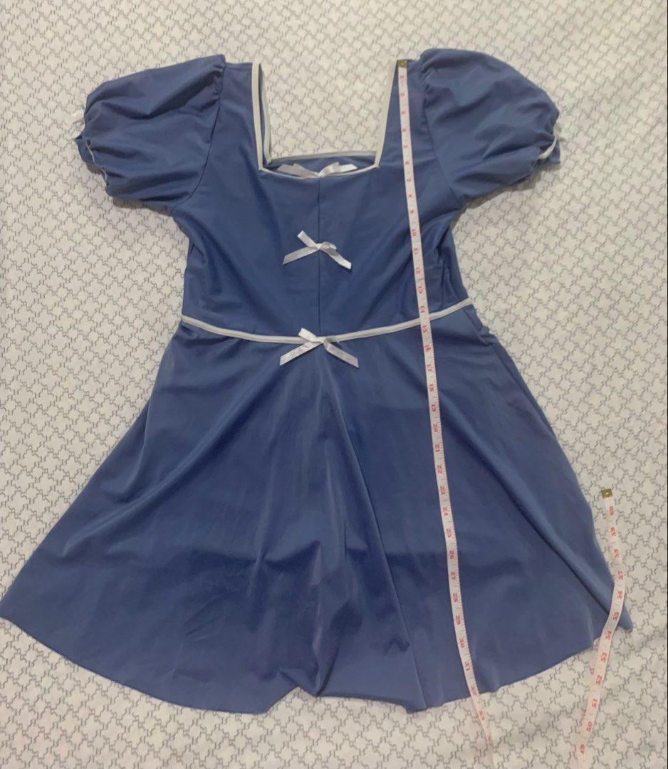 Blue Puff Sleeve Square Neck Dress with Bows (Category: Dresses) located in Paranaque City. Submitted by vbvessentials (Listing ID 1448836614, Image 3). Description: Cute blue dress with puff sleeves. Features a square neckline and a flattering A-line skirt. Adorned with small white bows at the front. Comes with built-in shorts. Great for casual outings or a themed event. -for teens.