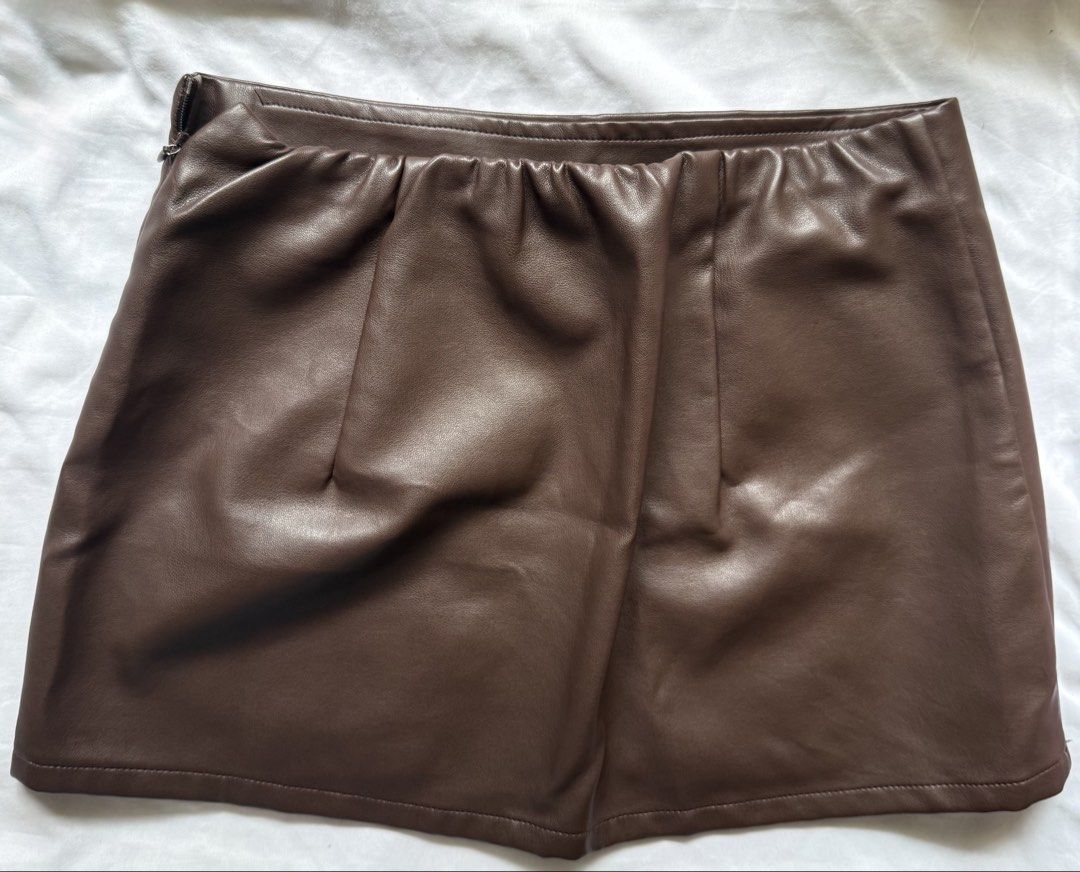 Brown Leather Skirt (Category: Skirts) located in Manila. Submitted by laviedeprim (Listing ID 1448745099, Image 2). Description: • Used once; good as new • RFS: decluttering & i barely repeat outfits • Delivery: [1] lalamove - based in bacoor, cavite [2] meet-ups - sm bacoor / lrt 2 legarda • delivery fee is shouldered by buyer 🔖: mini skirt, skirt, leather skirt, brown skirt, shein.