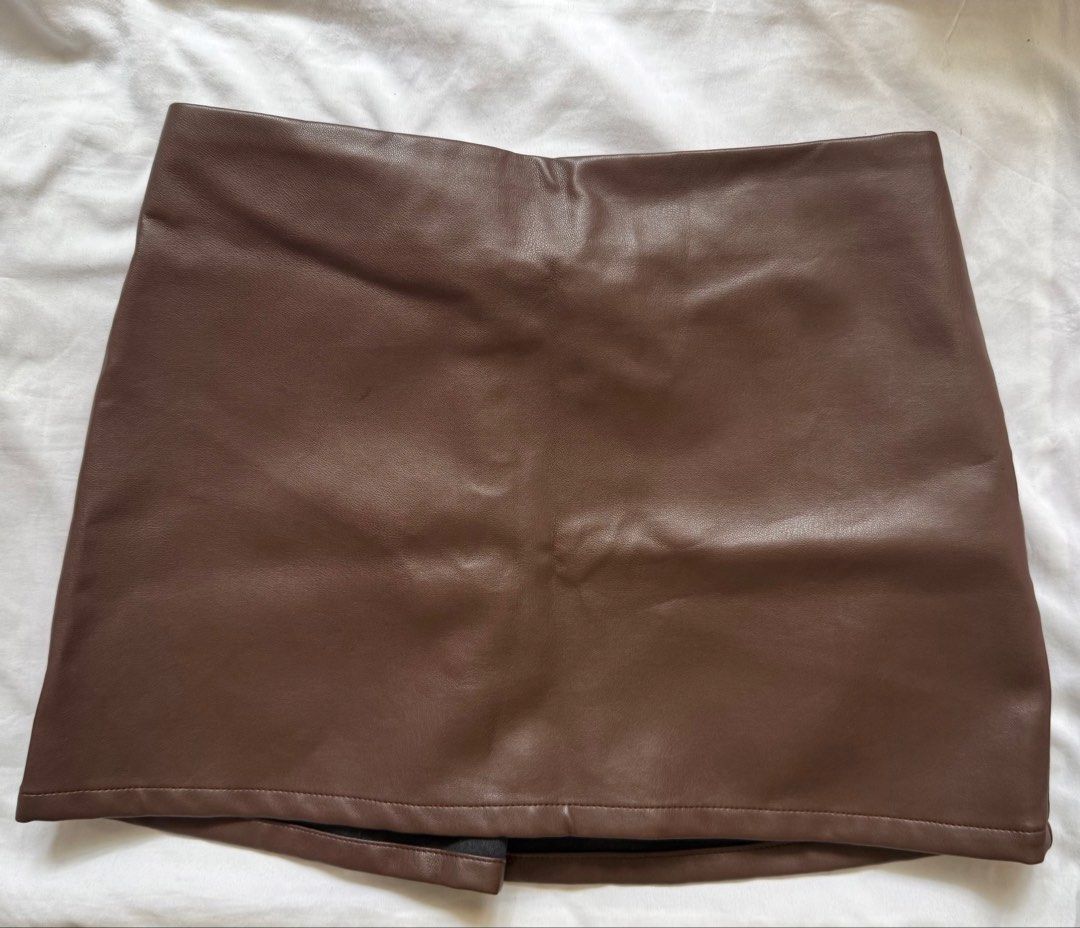 Brown Leather Skirt (Category: Skirts) located in Manila. Submitted by laviedeprim (Listing ID 1448745099, Image 1). Description: • Used once; good as new • RFS: decluttering & i barely repeat outfits • Delivery: [1] lalamove - based in bacoor, cavite [2] meet-ups - sm bacoor / lrt 2 legarda • delivery fee is shouldered by buyer 🔖: mini skirt, skirt, leather skirt, brown skirt, shein.