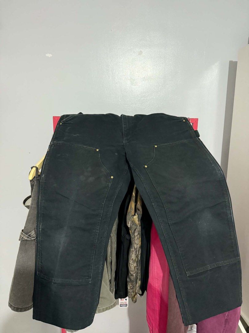 Carhartt Double Knee Work Pants Black (Category: Jeans) located in Bacoor. Submitted by bootsknocker (Listing ID 1448802859, Image 3). Description: - Classic Carhartt work pants in black. - Double knee construction for enhanced durability. - Multiple pockets for ample storage. - Ideal for work or everyday wear. - A timeless wardrobe staple. -34 WAIST -39 LENGTH -9.5 HEM -11 thigh -GUARANTEED AUTHENTIC ✅ -5000 nego.