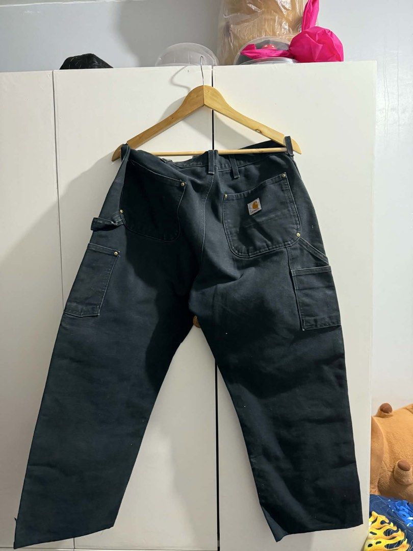 Carhartt Double Knee Work Pants Black (Category: Jeans) located in Bacoor. Submitted by bootsknocker (Listing ID 1448802859, Image 2). Description: - Classic Carhartt work pants in black. - Double knee construction for enhanced durability. - Multiple pockets for ample storage. - Ideal for work or everyday wear. - A timeless wardrobe staple. -34 WAIST -39 LENGTH -9.5 HEM -11 thigh -GUARANTEED AUTHENTIC ✅ -5000 nego.