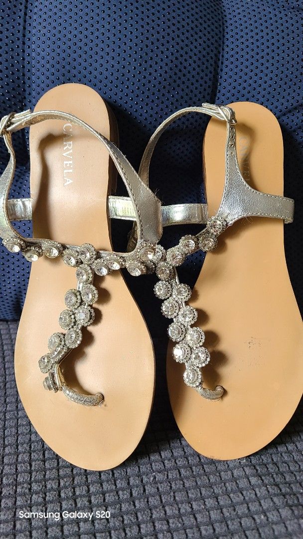 Carvela Silver Embellished Thong Sandals (Category: Flats & Sandals) located in Mandaluyong City. Submitted by Michkam021 (Listing ID 1448716848, Image 1). Description: - Brand: Carvela - Style: Silver thong sandals - Embellishment: Sparkly rhinestones across the strap - Closure: Adjustable buckle - Sole: Flat for comfort - Occasion: Perfect for dressing up any outfit.