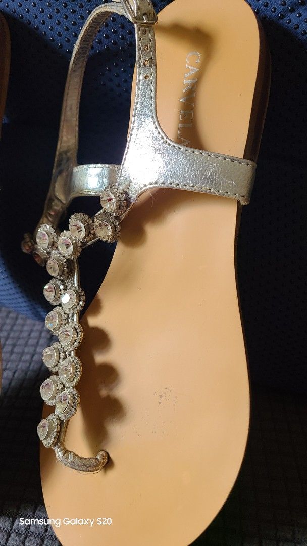 Carvela Silver Embellished Thong Sandals (Category: Flats & Sandals) located in Mandaluyong City. Submitted by Michkam021 (Listing ID 1448716848, Image 2). Description: - Brand: Carvela - Style: Silver thong sandals - Embellishment: Sparkly rhinestones across the strap - Closure: Adjustable buckle - Sole: Flat for comfort - Occasion: Perfect for dressing up any outfit.