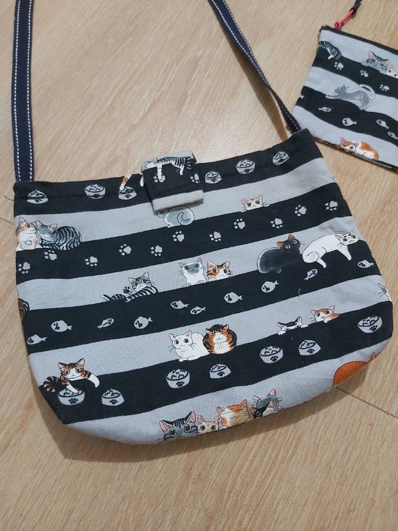 CATS SLING BAG & POUCH SET (Category: Cross-body Bags) located in Bulacan. Submitted by nansantiago (Listing ID 1448883821, Image 2). Description: CATS SLING BAG & POUCH SET Sling bag: 10x7x1.5" inches Pouch: 7x5" inches 🏷️ ₱170 set‼️ 📍 Location: Plaridel, Bulacan 💸 Mode of Payments: Gcash / BPI 📦 Pick-up / Ship 🚚 Couriers : Flash Express / SPX / Lalamove.