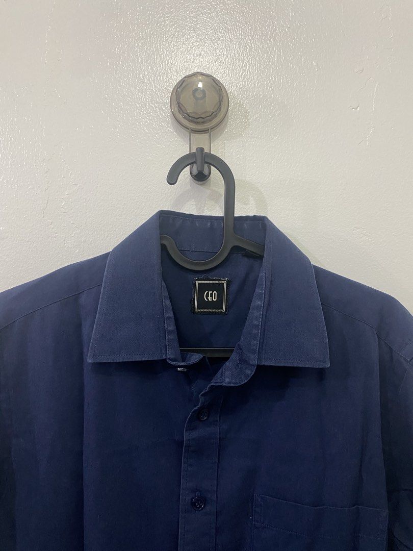 CEO Long Sleeve Button Up Shirt Navy Blue (Category: Tshirts & Polo Shirts ) located in Makati City. Submitted by hyperdrive_mnl (Listing ID 1448871246, Image 3). Description: - Navy blue long sleeve shirt - Brand: CEO - Classic button-up style - Standard fit - Suitable for work or casual wear - Simple and versatile design - Please check photos for detailed condition.