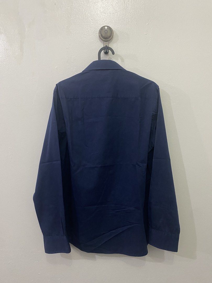 CEO Long Sleeve Button Up Shirt Navy Blue (Category: Tshirts & Polo Shirts ) located in Makati City. Submitted by hyperdrive_mnl (Listing ID 1448871246, Image 2). Description: - Navy blue long sleeve shirt - Brand: CEO - Classic button-up style - Standard fit - Suitable for work or casual wear - Simple and versatile design - Please check photos for detailed condition.