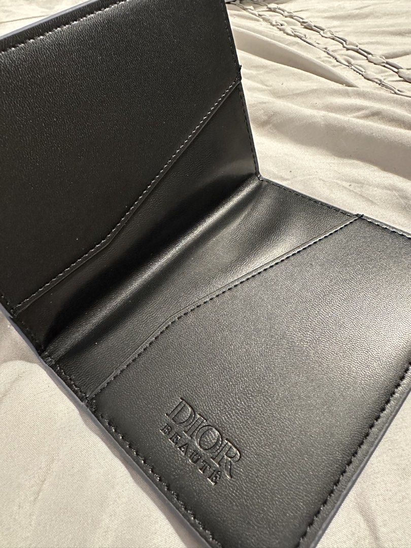 Christian Dior Passport Holder (Category: Wallets & Card holders) located in Caloocan City. Submitted by greenboxpackaging (Listing ID 1448706281, Image 2). Description: Brandnew Christian Dior Beauté passport holder in Navy Blue color..