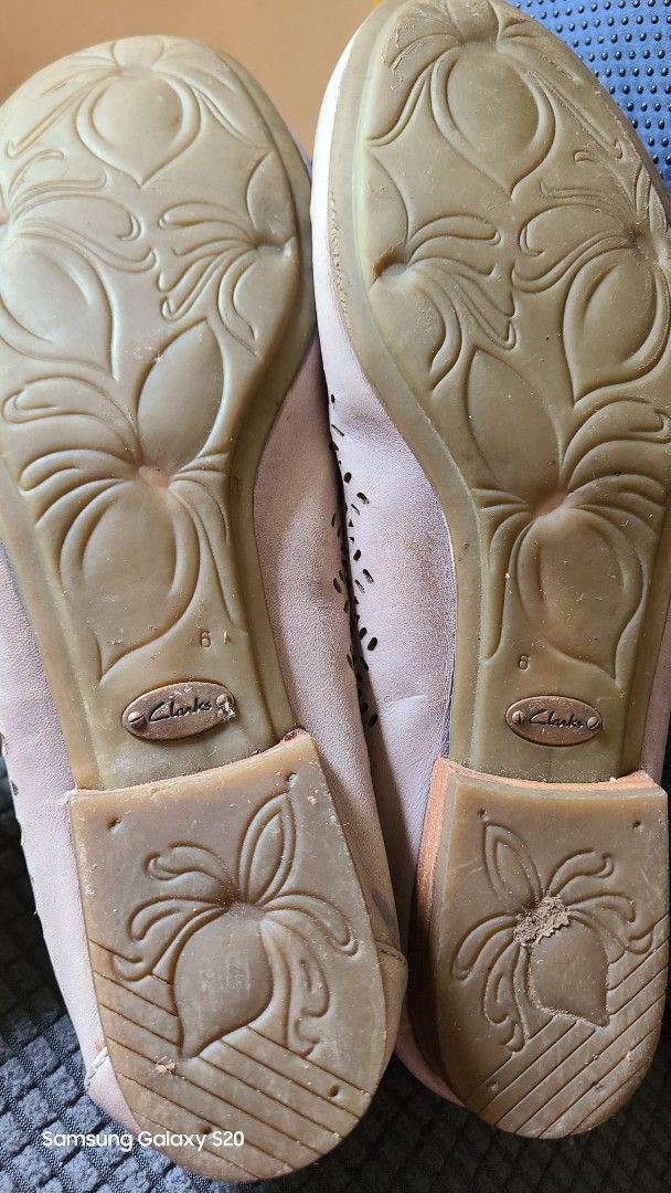 Clarks Active Air White Laser Cut Ballet Flats (Category: Flats & Sandals) located in Mandaluyong City. Submitted by Michkam021 (Listing ID 1448716245, Image 3). Description: - White Clarks ballet flats - Elegant laser cut details - Comfortable and breathable design - Features Active Air cushioning for all-day comfort - Unique floral pattern on the sole - Ideal for everyday wear - Note: Minor marks present on the inside heel area.
