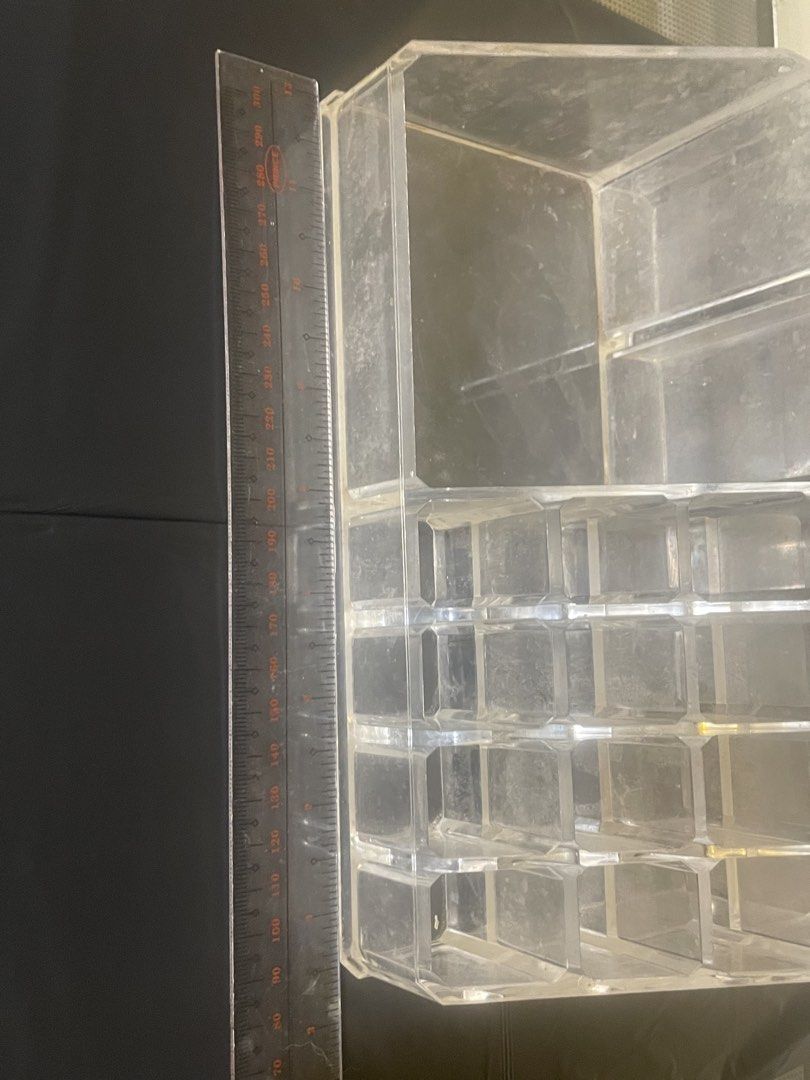 Clear Acrylic Makeup Organizer with Multiple Compartments (Category: Makeup) located in Quezon City. Submitted by romsr (Listing ID 1448737358, Image 3). Description: I recently washed it with water and did not dry up perfectly - needs wiping but otherwise in perfect condition - Keep your vanity tidy with this clear acrylic organizer. - Features multiple sections for lipsticks, brushes, and other beauty items. - Ideal for storing and showcasing y