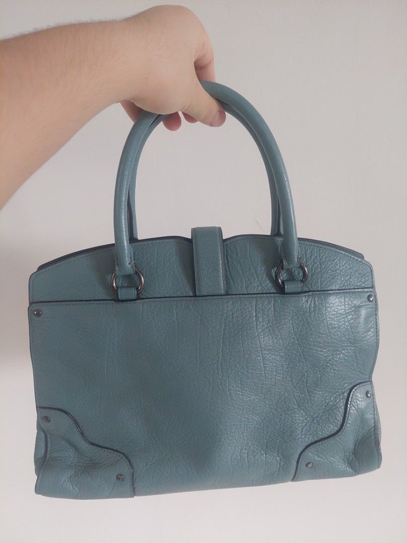 Coach Leather Satchel Handbag (Category: Luxury Bags & Wallets) located in Antipolo. Submitted by alaljr (Listing ID 1448715696, Image 2). Description: Coach Mercer Satchel 30 - Color: Teal/Cloud Blue - Material: Grain Leather - Style: Satchel/Crossbody/Handbag - Features: Top handle, buckle closure strap - Interior: Zippered compartment, additional pockets - Condition: Clean inside and out - Size: Perfect for everyday use.