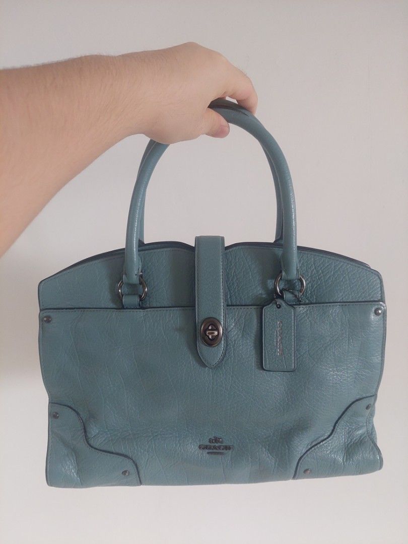 Coach Leather Satchel Handbag (Category: Luxury Bags & Wallets) located in Antipolo. Submitted by alaljr (Listing ID 1448715696, Image 1). Description: Coach Mercer Satchel 30 - Color: Teal/Cloud Blue - Material: Grain Leather - Style: Satchel/Crossbody/Handbag - Features: Top handle, buckle closure strap - Interior: Zippered compartment, additional pockets - Condition: Clean inside and out - Size: Perfect for everyday use.