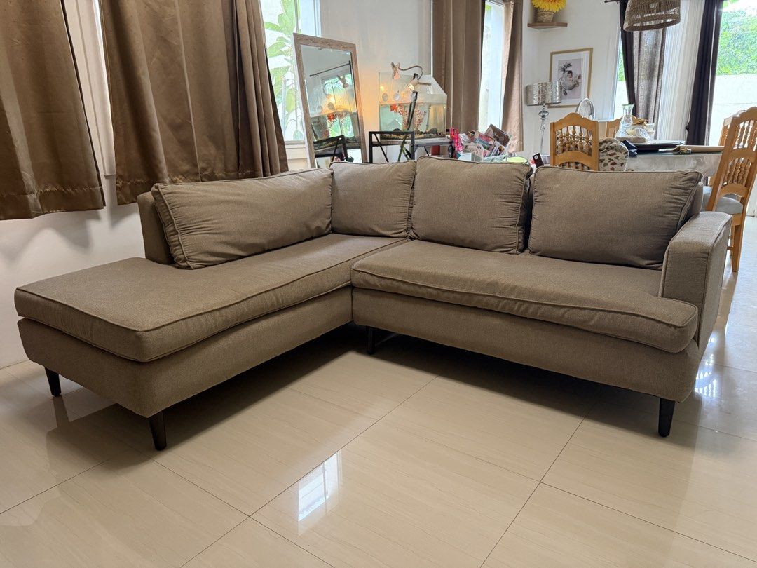 Mandaue Foam L-Shaped Sofa | Beige | Good Condition (Category: Sofas) located in Manila. Submitted by tsdivinagracia (Listing ID 1448818917, Image 1). Description: Mandaue Foam L-Shaped Sofa | Beige | Good Condition 💰 ₱15,000 Selling our Mandaue Foam L-shaped sofa in good condition. ✨ Features: * 4 years old * Clean and well-maintained * Comfortable and sturdy * Neutral beige fabric that matches most home interiors * No major stains, tears, or s