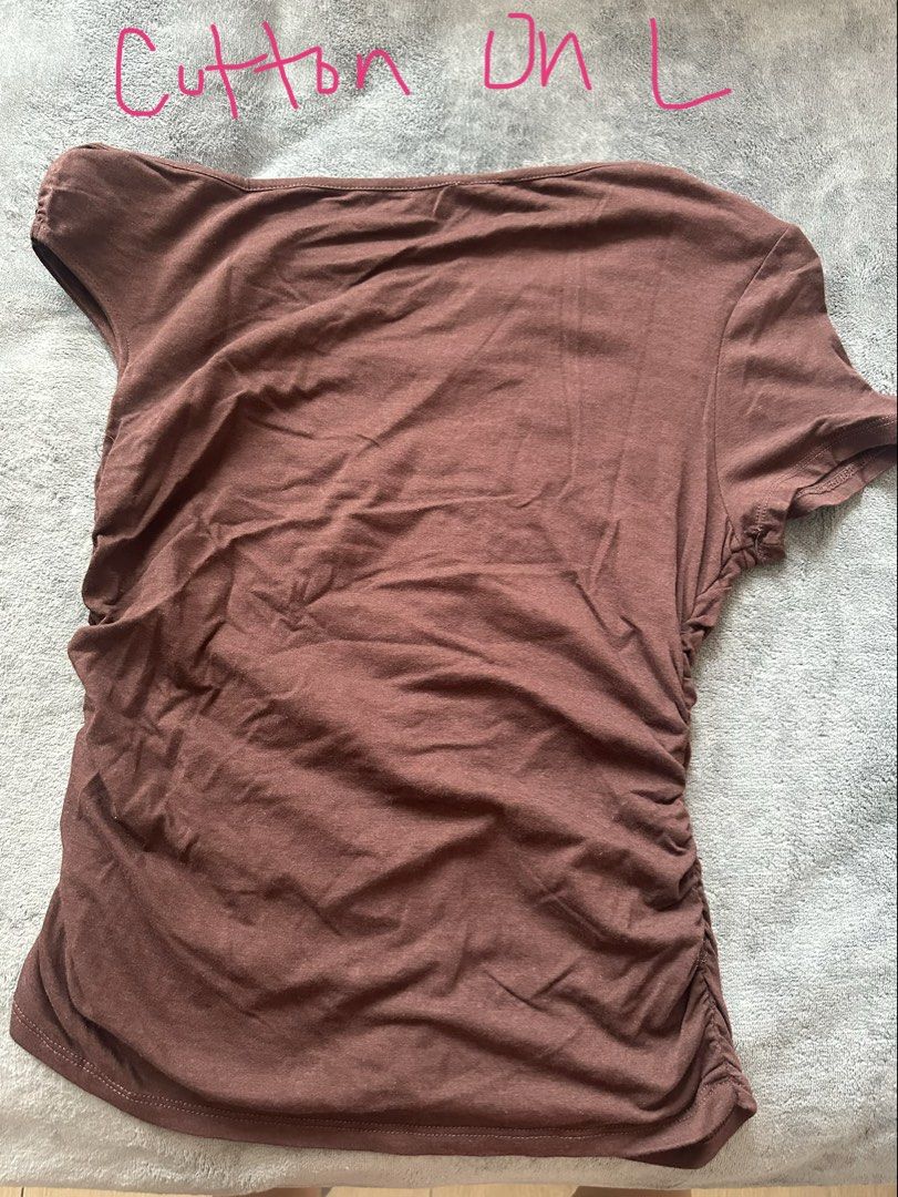 Cotton On Brown Ruched One Shoulder Top Size L (Category: Sleeveless) located in Taguig. Submitted by stigmapanda (Listing ID 1448824098, Image 2). Description: - Brand: Cotton On - Color: Brown - Size: L - Style: One-shoulder, short sleeves - Design: Ruched detailing on the side - Fabric: Soft and stretchy - Versatility: Perfect for dressing up or down.