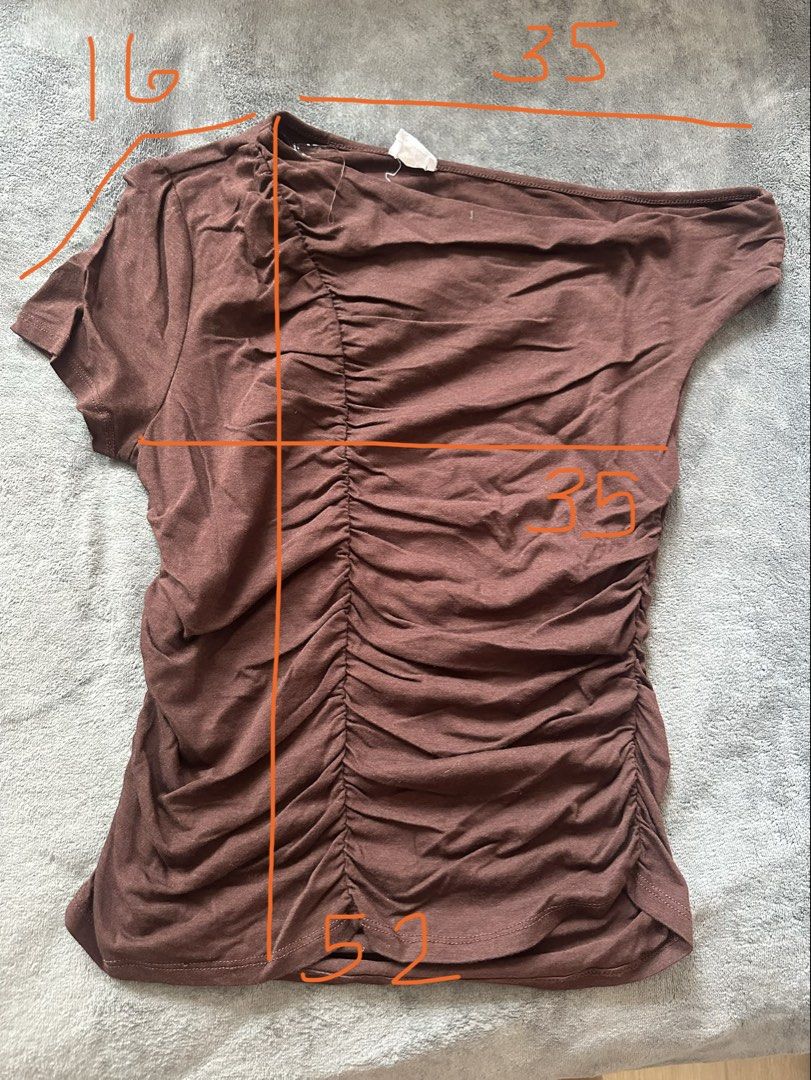 Cotton On Brown Ruched One Shoulder Top Size L (Category: Sleeveless) located in Taguig. Submitted by stigmapanda (Listing ID 1448824098, Image 3). Description: - Brand: Cotton On - Color: Brown - Size: L - Style: One-shoulder, short sleeves - Design: Ruched detailing on the side - Fabric: Soft and stretchy - Versatility: Perfect for dressing up or down.