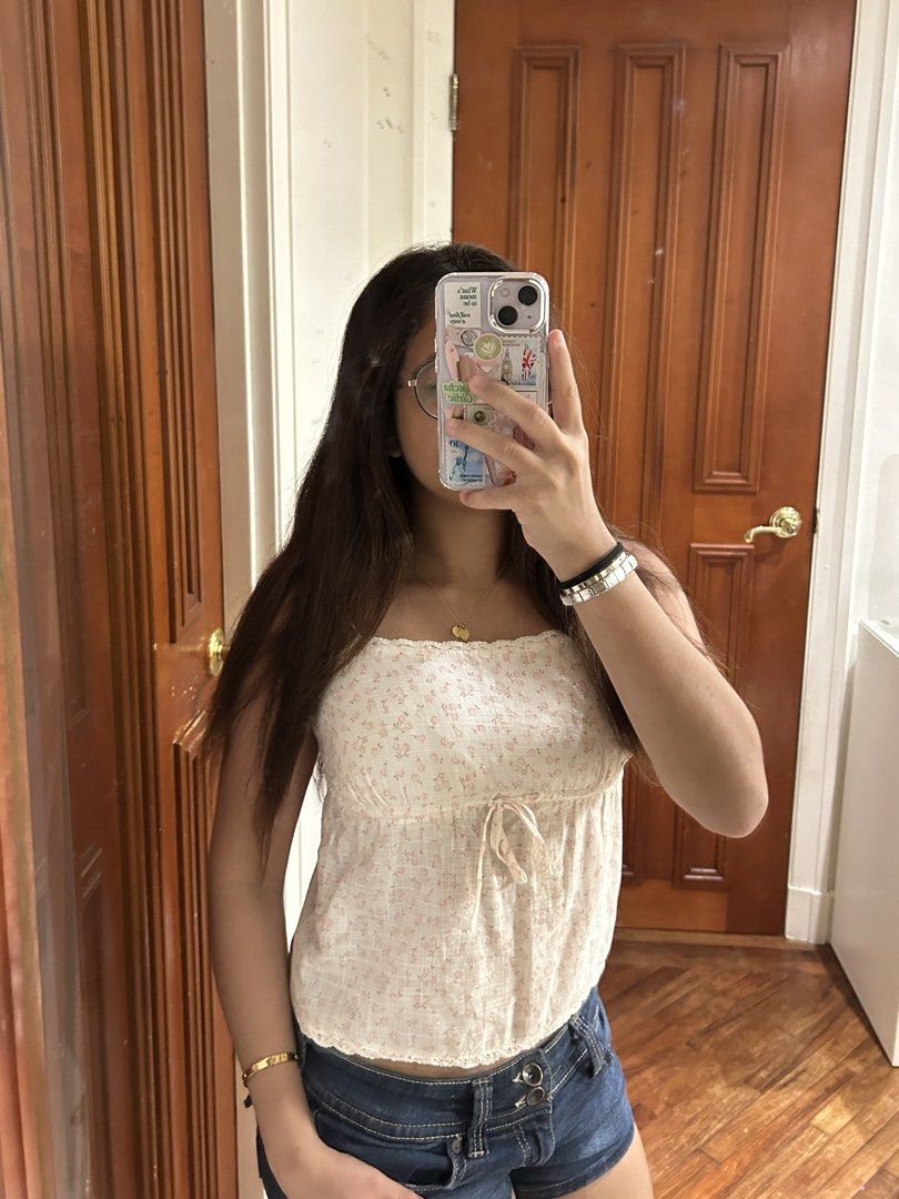 cotton on floral tank top (Category: Sleeveless) located in Manila. Submitted by ayannadeclutters (Listing ID 1448868239, Image 3). Description: - rarely worn - light pink and white floral design - comes with tie in the front and plain at the back - fitted in chest; flowy bottom fit .