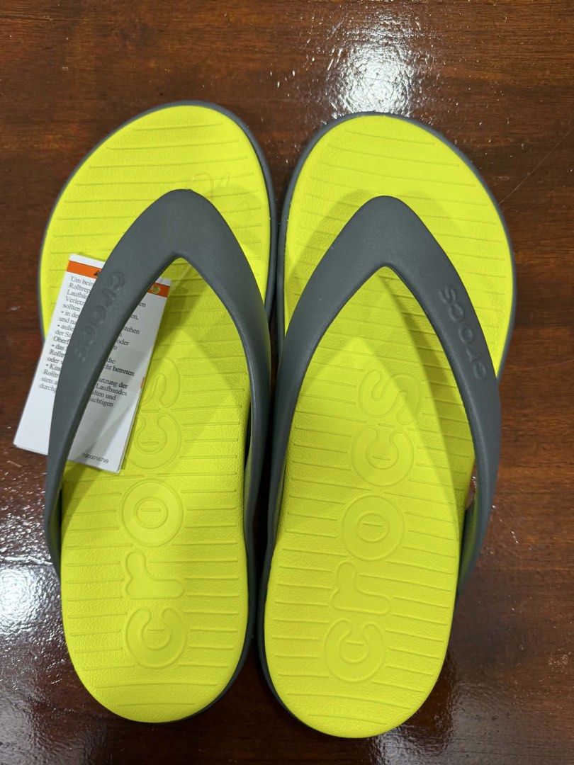 Crocs Flip-Flops Yellow Green and Grey (Category: Slippers & Slides) located in Makati City. Submitted by beguiling (Listing ID 1448774511, Image 1). Description: - Comfortable Crocs flip-flops - Bright yellow footbed with grey straps - Durable sole with excellent grip pattern - Ideal for casual outings and beach days - Easy slip-on design for convenience.