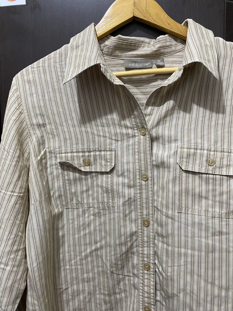 Croft & Barrow Striped Button-Up Shirt (Category: Tshirts & Polo Shirts ) located in Cavite. Submitted by grabanddeclutter (Listing ID 1448835637, Image 3). Description: - Subtle beige and brown vertical stripe pattern - Two chest pockets with button closures - Three-quarter length sleeves - No issues!! Perfect for casual wear or layering!! - Dimensions: Width 23 Length 26.5 No COD gcash payment Plus shipping fee Jnt or lalamove.