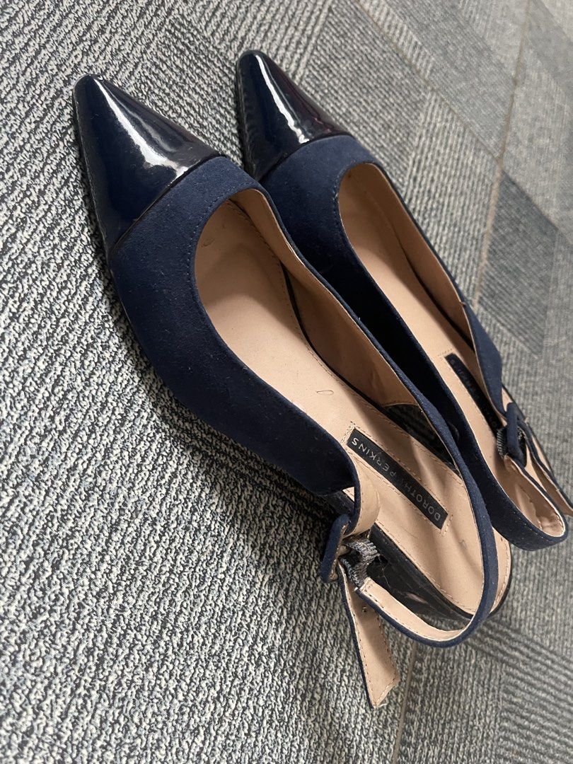 Dorothy Perkins Navy Blue Slingback Heels (Category: Heels) located in Tagaytay City. Submitted by janey_22 (Listing ID 1448838200, Image 2). Description: - Navy blue slingback heels from Dorothy Perkins - Chic pointed toe with a glossy patent finish - Secure and adjustable strap with buckle closure - Comfortable low heel for all-day wear - Versatile: ideal for office or evening events.