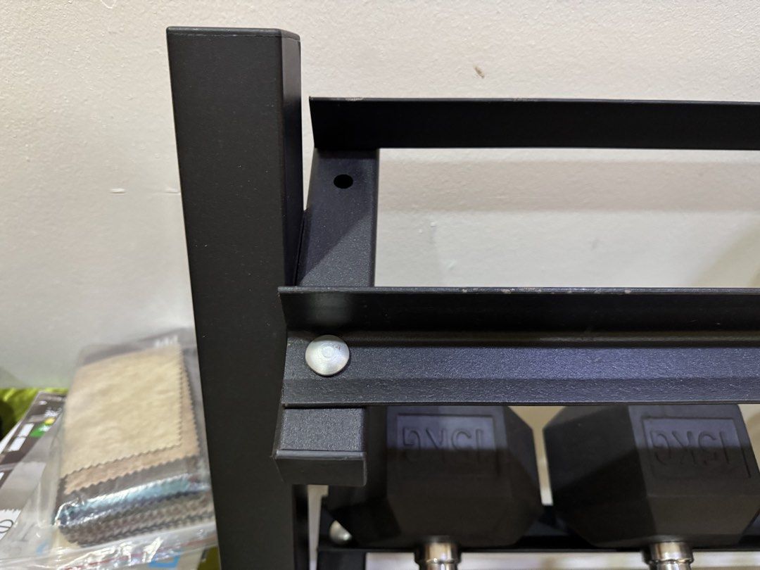 Dumbbell Rack (Category: Other Sports Equipment and Supplies) located in Kuala Lumpur. Submitted by khaiyuen98 (Listing ID 1448840947, Image 2). Description: - Sturdy black metal dumbbell rack - Multiple tiers for organized storage - Suitable for various dumbbell sizes and types - Helps keep your home gym tidy and accessible - Durable construction 98cm Width x 50cm Length x 93cm Height.