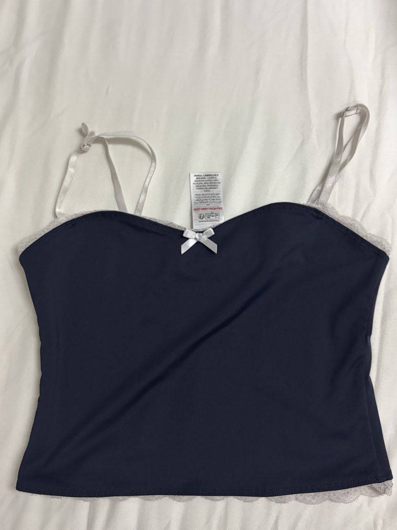 Edikted Navy Blue Cami Top with Lace Trim (Category: Sleeveless) located in Quezon City. Submitted by raiscloset (Listing ID 1448773790, Image 1). Description: - White lace trim on hem and neckline - Adjustable straps - Last price posted!.