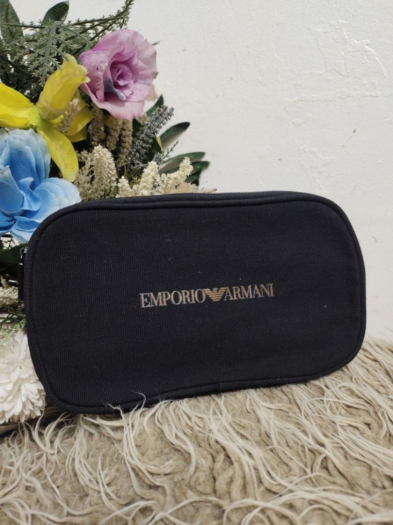 Emporio Armani Black Canvas Utility Pouch (Category: Purses & Pouches) located in Baguio. Submitted by PreiLoveMaria (Listing ID 1448805345, Image 2). Description: Emporio Armani Black Canvas Utility Pouch crafted from a durable, crisp black woven canvas. Featuring the iconic eagle logo and brand name across the front, it is the perfect size to use as a luxury cosmetic bag, travel toiletry pouch, or a sleek tech organizer. ​Product Details & Feat