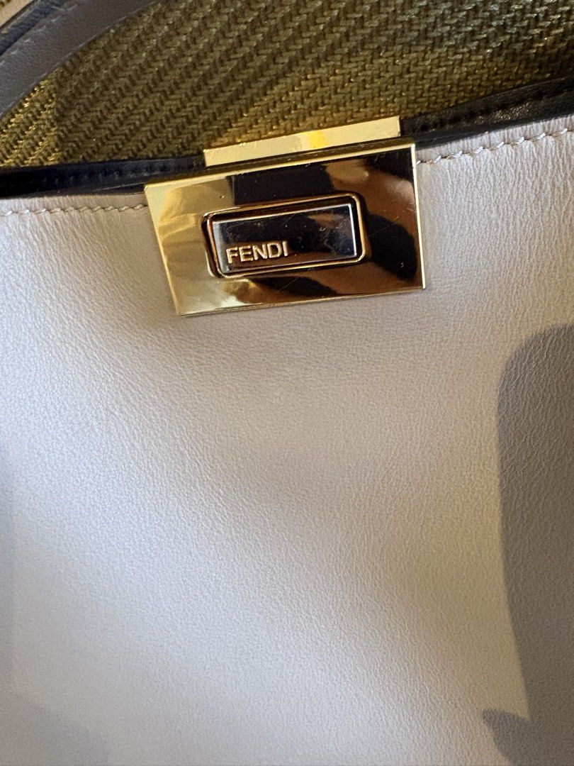 Fendi Peekaboo Bag Taupe Leather (Category: Luxury Bags & Wallets) located in Makati City. Submitted by rumnougat (Listing ID 1448843555, Image 3). Description: - Authentic Fendi Peekaboo Bag - Color: Taupe - Material: Genuine Leather - Hardware: Gold - Iconic Fendi Clasp - Features: Top handle and detachable shoulder strap - Interior: Black - Condition: Good - Versatile: Ideal for everyday or special occasions BAG ONLY No more bag pouch 💯 guara