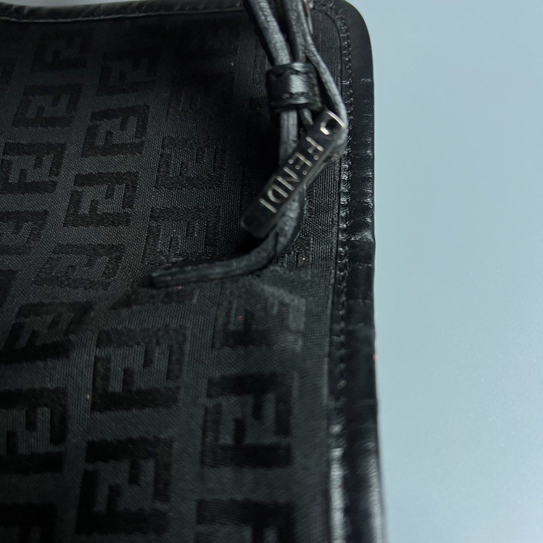 Fendi Zucca Monogram Canvas Crossbody Bag (Category: Luxury Bags & Wallets) located in Bago City. Submitted by g___shop (Listing ID 1448814011, Image 3). Description: - Authentic - Rank a - Classic Fendi crossbody bag - Iconic Zucca monogram pattern - Black canvas with leather trim - Adjustable strap for comfortable wear - Small buckle closure on flap - Ideal for everyday use - Shows minimal signs of wear.