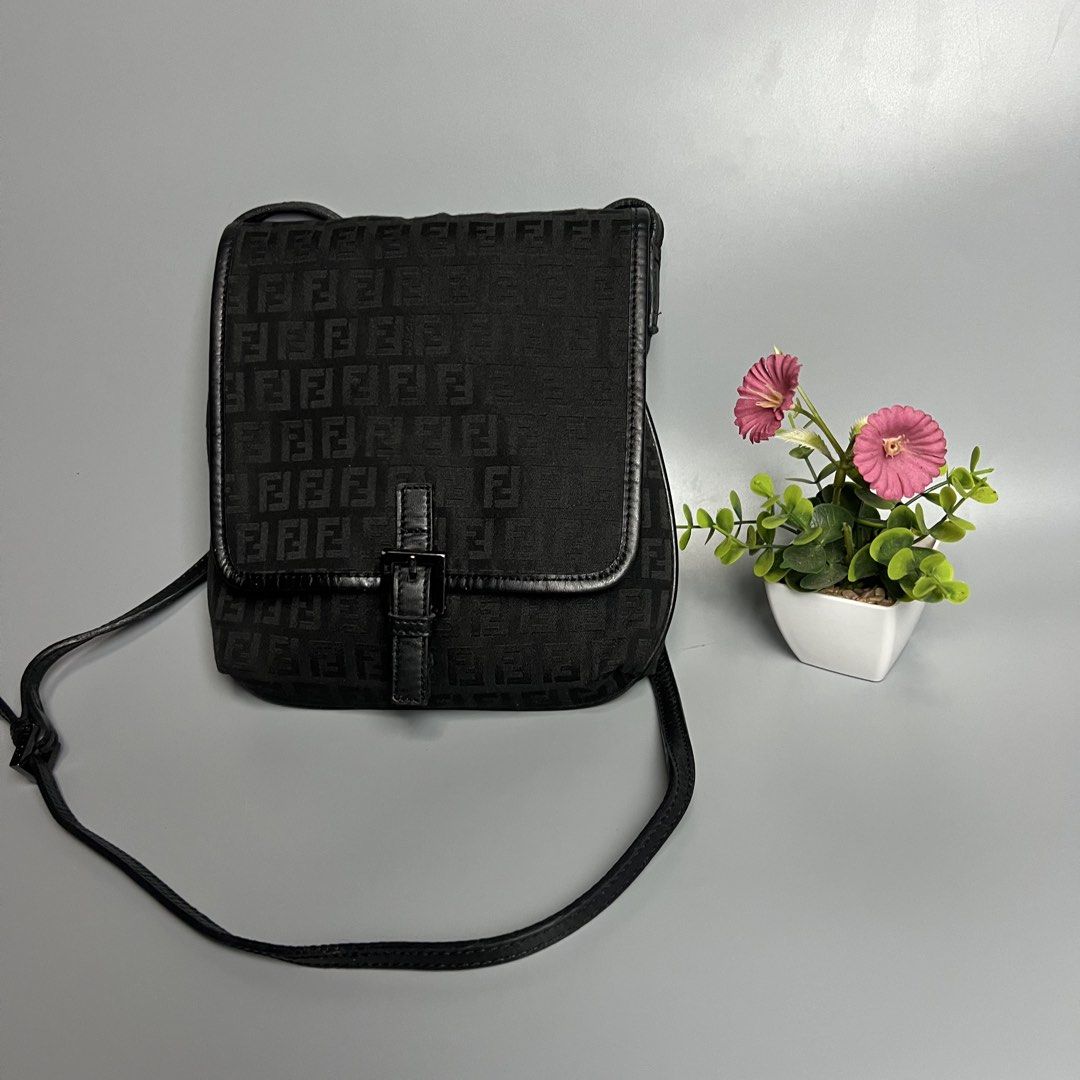 Fendi Zucca Monogram Canvas Crossbody Bag (Category: Luxury Bags & Wallets) located in Bago City. Submitted by g___shop (Listing ID 1448814011, Image 2). Description: - Authentic - Rank a - Classic Fendi crossbody bag - Iconic Zucca monogram pattern - Black canvas with leather trim - Adjustable strap for comfortable wear - Small buckle closure on flap - Ideal for everyday use - Shows minimal signs of wear.