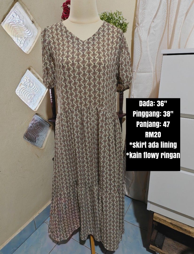 Flowy Midi Dress with Geometric Pattern (Category: Dresses) located in Kota Belud. Submitted by jeohana (Listing ID 1448720895, Image 1). Description: - Chic brown and beige geometric print midi dress. - Flattering V-neckline and comfortable short sleeves. - Light, flowy skirt with an inner lining for modesty. - Measurements: Bust 36", Waist 38", Length 47". - Ideal for everyday casual wear..