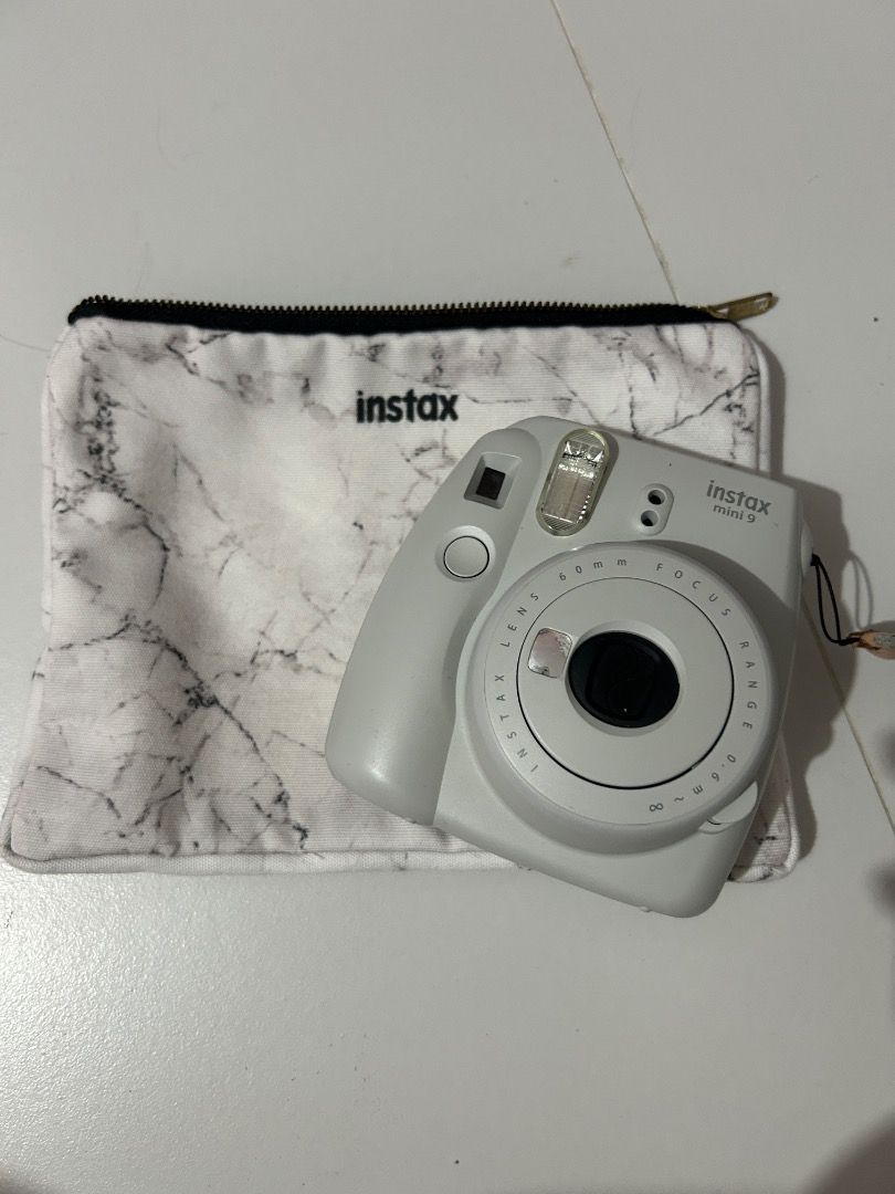 Fujifilm Instax Mini 9 Camera with Marble Pouch (Category: Cameras) located in Guagua. Submitted by missbettyboop (Listing ID 1448815180, Image 1). Description: Bought brand new More or less than 6 times lang nagamitan ng instax film With pouch that it came with Natapon ko na box No obvious scratches, naingatan ko, hindi ko na nagagamit dahil laging phone na lang and hindi ko na nabibilhan film - Fujifilm Instax Mini 9 Camera - Includes a cute ma