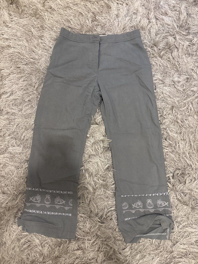 Grey Capris with Embroidered Fish Detail (Category: Other Bottoms) located in Las Pinas. Submitted by bihon (Listing ID 1448794132, Image 1). Description: - Grey straight-leg pants - Features a fun white embroidered fish pattern along the hem - Comfortable for casual, everyday wear - Versatile for various outfits.
