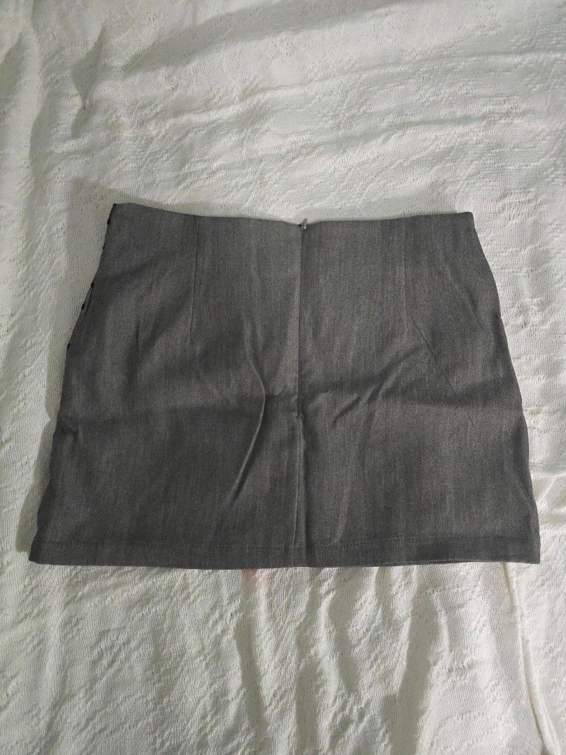 Grey Polka Dot Sheer Overlay Mini Skirt (Category: Skirts) located in Meycauayan. Submitted by saurfee (Listing ID 1448809290, Image 2). Description: - Grey mini skirt - Sheer polka dot overlay - Side zipper closure - Size L but run small - Has built in inner shorts - Never used out, just fitted - Estimated size: Medium - Waist 28 in, Hips 34 in, Length 13 in (1-2 cm measurement difference).