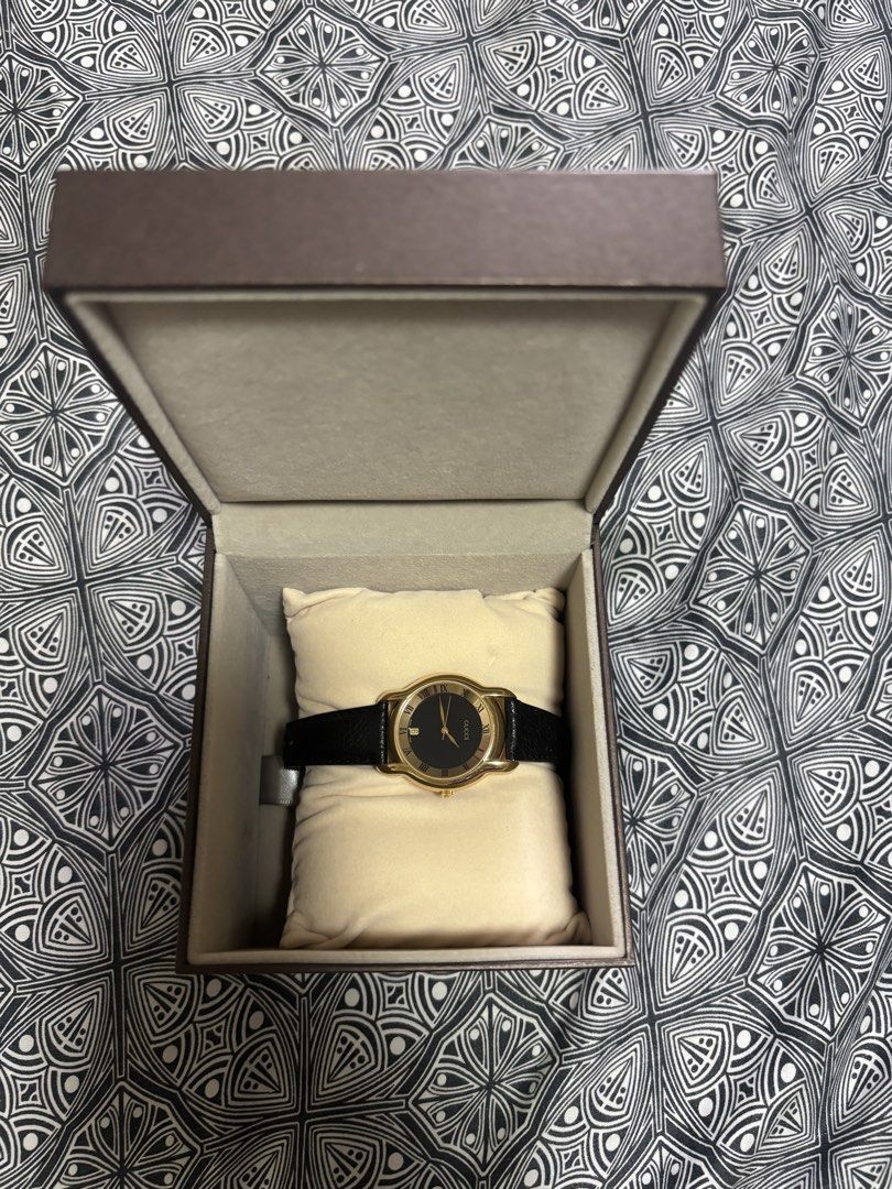 Gucci Watch Gold Black Leather Strap (Category: Luxury Watches) located in Quezon City. Submitted by engr36 (Listing ID 1448746110, Image 1). Description: - Authentic Gucci watch - Gold-tone casing - Black dial - Black leather strap - Original Gucci box included.