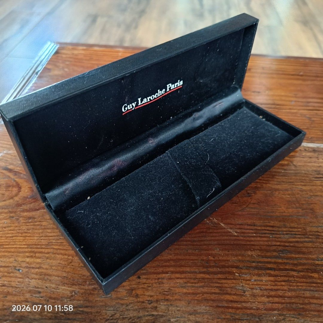 Guy Laroche Paris Watch Case (Category: Luxury Watches) located in Calasiao. Submitted by anthonypeter (Listing ID 1448733840, Image 2). Description: - Original Guy Laroche Paris watch case - Classic black exterior - Soft velvet interior lining - Designed to hold one watch - Perfect for storage or gifting - Shows minor signs of use inside (please check photos for details).
