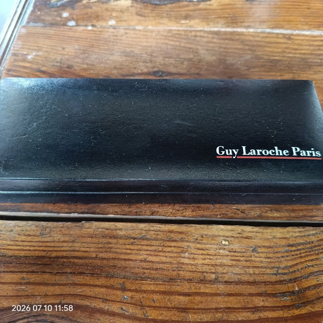 Guy Laroche Paris Watch Case (Category: Luxury Watches) located in Calasiao. Submitted by anthonypeter (Listing ID 1448733840, Image 3). Description: - Original Guy Laroche Paris watch case - Classic black exterior - Soft velvet interior lining - Designed to hold one watch - Perfect for storage or gifting - Shows minor signs of use inside (please check photos for details).