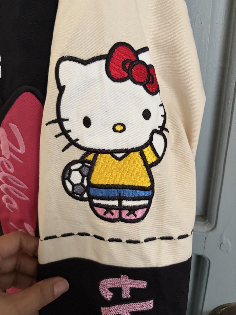 Hello Kitty Racer jacket (Category: Coats, Jackets and Outerwear) located in Rizal. Submitted by katmandulovesmakeup (Listing ID 1448715757, Image 3). Description: Bnew with tags Cute Hello Kitty racer jacket Embroidered design and cute hk sleeves details Navy blue Size medium - oversize fit.