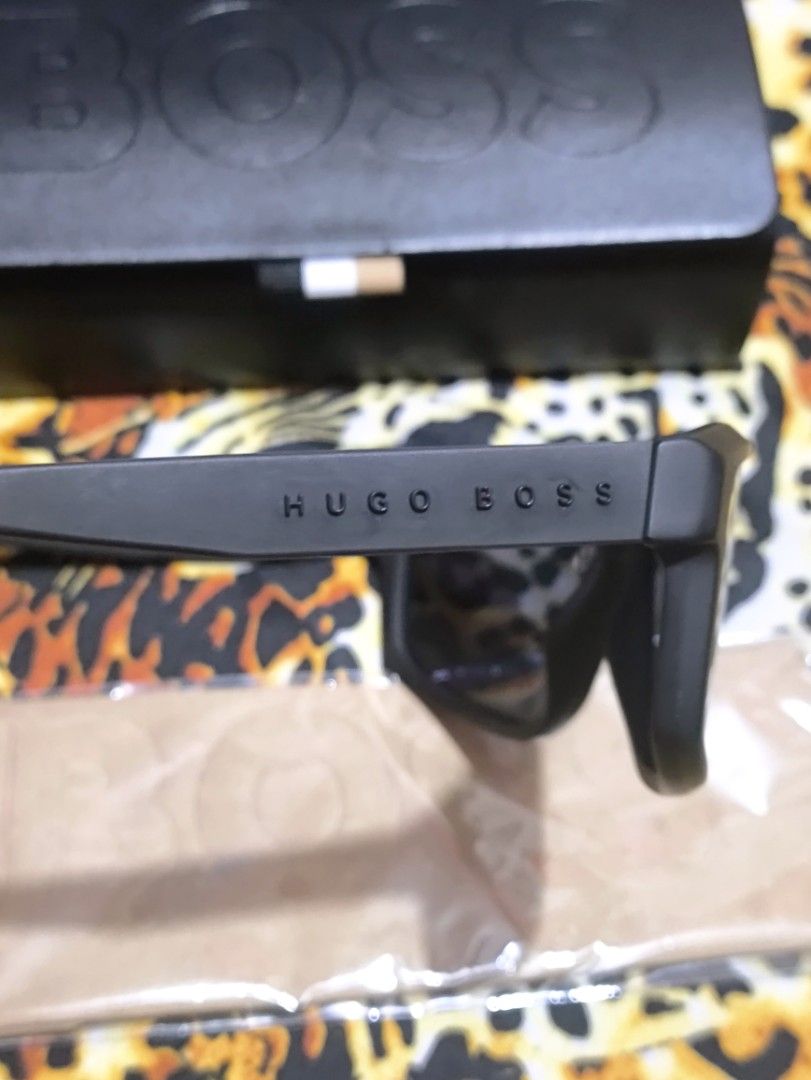 Hugo Boss Sunglasses with Case and Cloth (Category: Sunglasses & Eyewear) located in Manila. Submitted by joshramly (Listing ID 1448815080, Image 2). Description: - Authentic Hugo Boss sunglasses - Sleek black frame - Stylish mirrored lenses - Expertly crafted in Italy - Comes with original BOSS case - Includes original cleaning cloth - Ideal for sunny weather and outdoor activities.